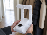 WarmStep boot dryer folded flat, held in hands