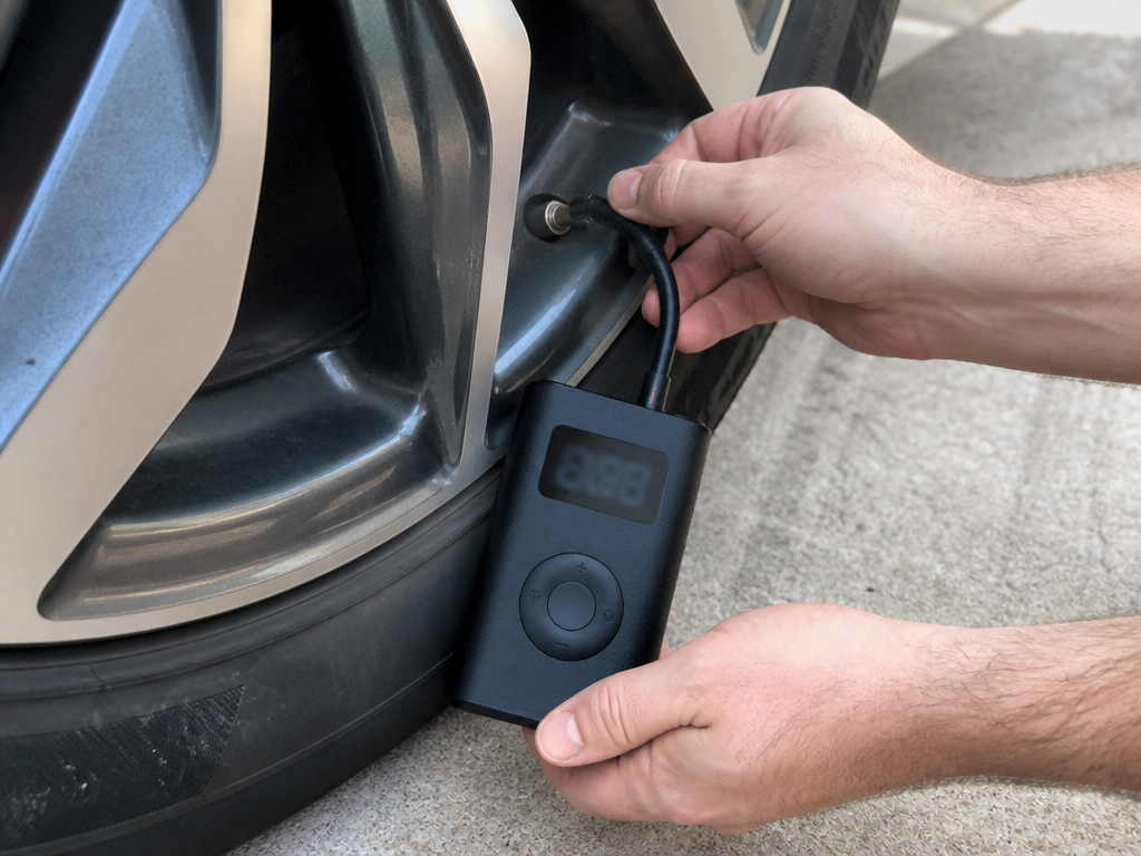 AirMate hose being attached to a car tire valve