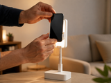 Clipping a smartphone into the FoldFrame stand with fill light