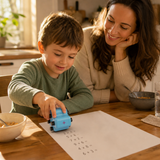 Parent and child using the NumberRoll math roller stamp at the kitchen table