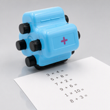 NumberRoll 4-in-1 math roller stamp with a printed column of math problems, studio shot