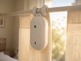 GlideGlow curtain robot opening a curtain in morning light
