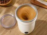 Coffee swirling in a vortex inside Stirly