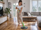 Woman mopping a living room floor with the GlideMate mop