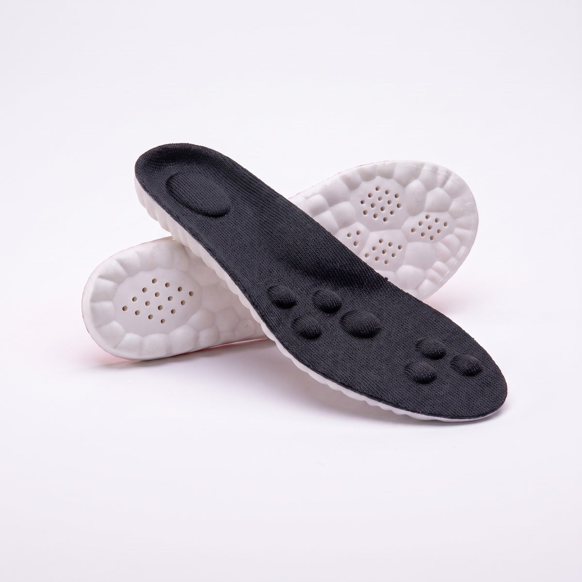 Black massage insoles, top and underside